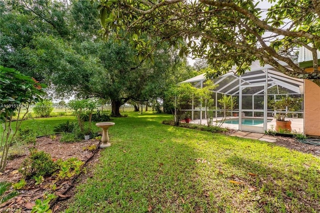 4559 Springview Cir, La Belle, FL 33935 - view of green lawn featuring an outdoor pool and a lanai