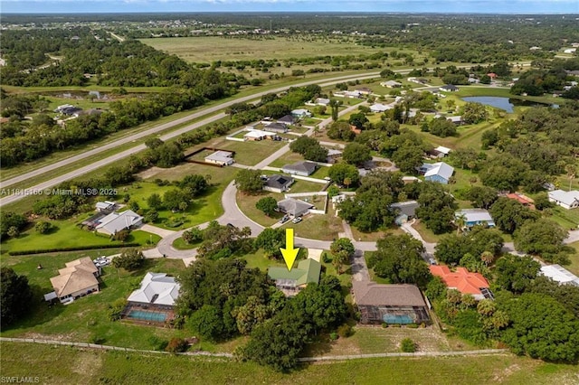 4559 Springview Cir, La Belle, FL 33935 - aerial overview of property's location with a nearby body of water and nearby suburban area