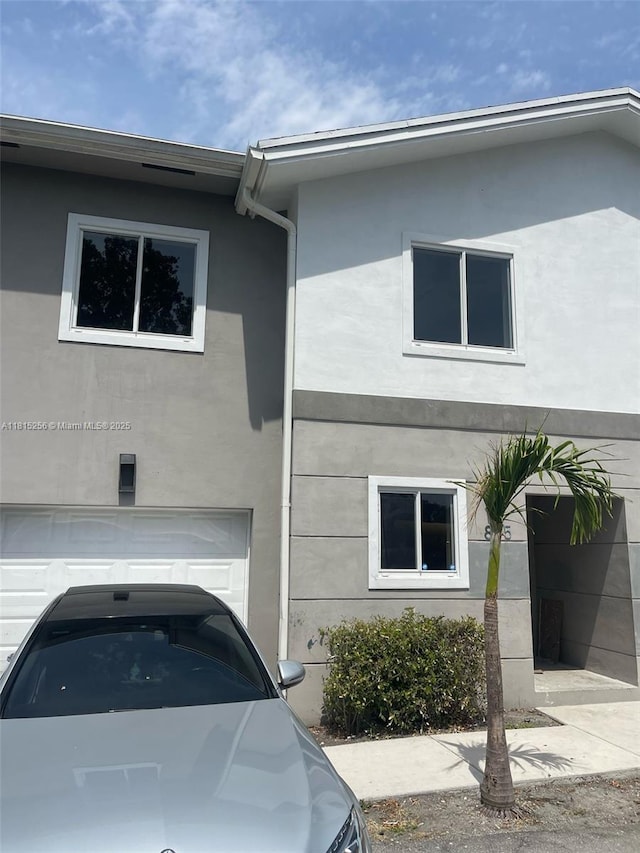 811 NW 3rd Ave, Fort Lauderdale, FL 33311 - view of front of property featuring stucco siding and a garage