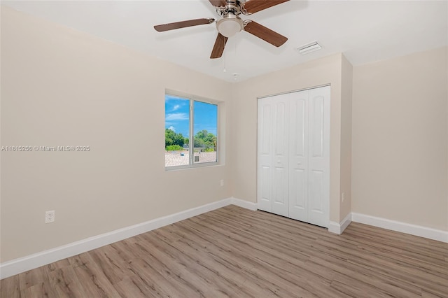 811 NW 3rd Ave, Fort Lauderdale, FL 33311 - unfurnished bedroom featuring wood finished floors, a closet, and ceiling fan