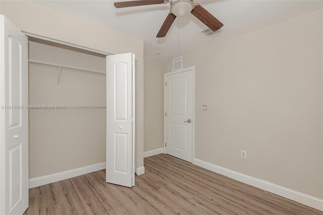 811 NW 3rd Ave, Fort Lauderdale, FL 33311 - unfurnished bedroom featuring wood finished floors, a closet, and a ceiling fan