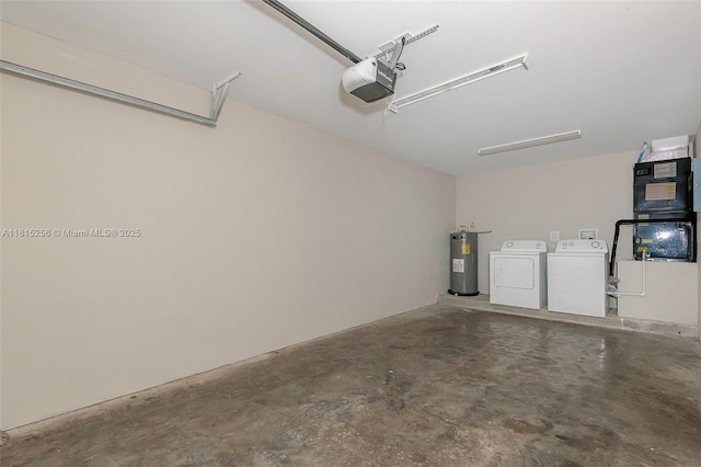 811 NW 3rd Ave, Fort Lauderdale, FL 33311 - garage featuring electric water heater, independent washer and dryer, and a garage door opener