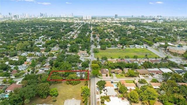 1051 NE 149th St, Miami, FL 33161 - aerial overview of property's location featuring city skyline and property boundaries highlighted