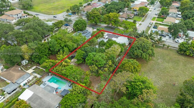 1051 NE 149th St, Miami, FL 33161 - aerial perspective of suburban area featuring property boundaries highlighted and a pool