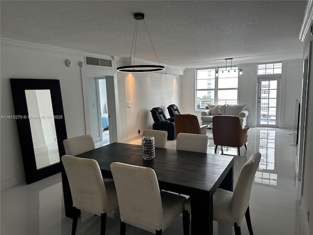 2851 S Ocean Blvd Unit 6V, Boca Raton, FL 33432 - dining area featuring a textured ceiling and ornamental molding