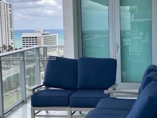 300 Sunny Isles Blvd Unit 4-1407, Sunny Isles Beach, FL 33160 - balcony with an outdoor living space, a water view, and a view of city