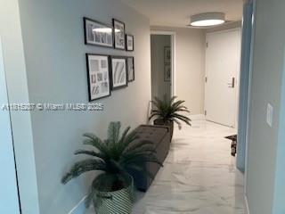 300 Sunny Isles Blvd Unit 4-1407, Sunny Isles Beach, FL 33160 - hallway featuring baseboards