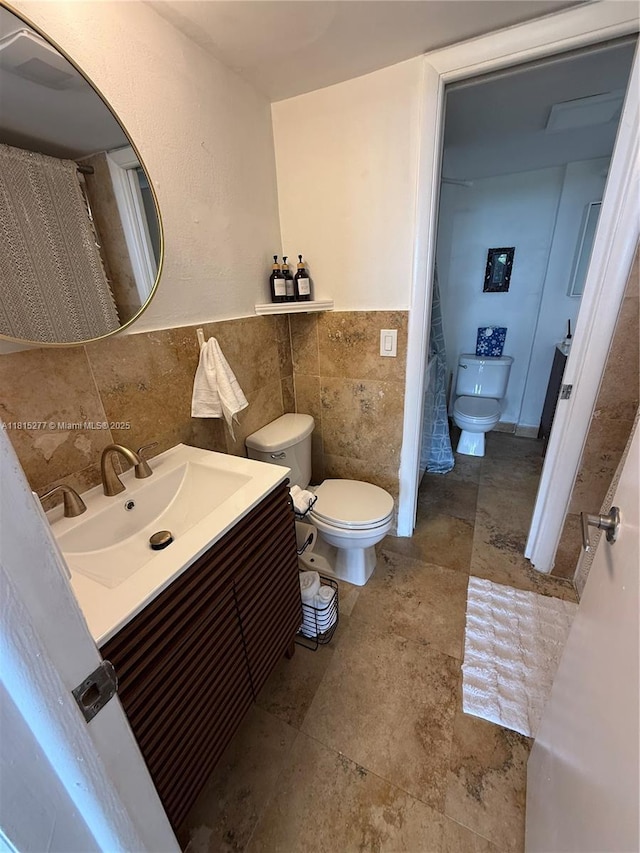5701 Biscayne Blvd Unit 701, Miami, FL 33137 - bathroom with tile walls, vanity, and wainscoting
