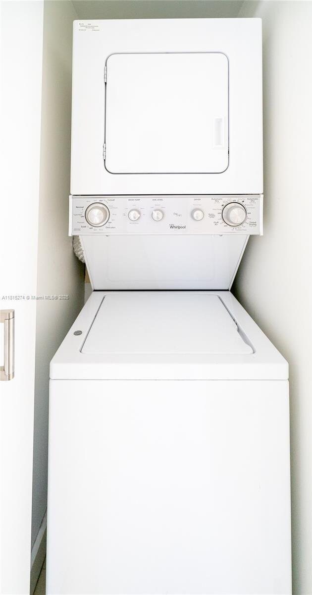 4000 Towerside Ter Unit 2201, Miami, FL 33138 - laundry room featuring stacked washer / drying machine