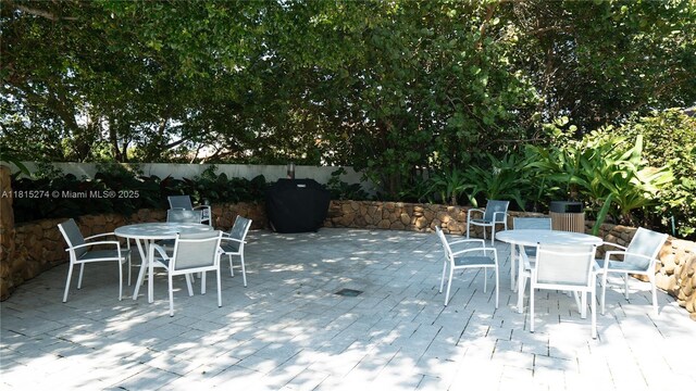 4000 Towerside Ter Unit 2201, Miami, FL 33138 - wooden deck featuring outdoor dining area and a patio