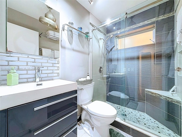 1420 Seagrape Cir, Weston, FL 33326 - full bath with toilet, tiled shower, vanity, and tasteful backsplash