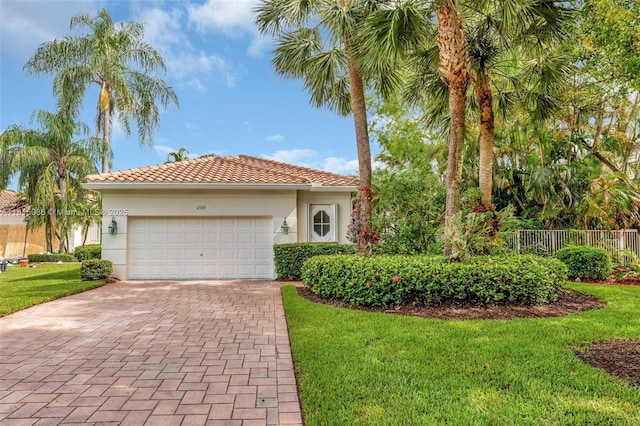2539 Bay Pointe Dr, Weston, FL 33327 - mediterranean / spanish house with decorative driveway, a garage, stucco siding, and a tiled roof