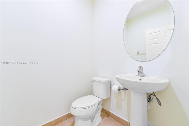 3420 W 92nd Pl, Hialeah, FL 33018 - half bathroom with toilet, tile patterned flooring, and baseboards