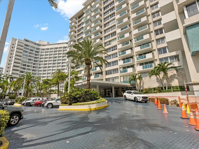 1200 W Ave Unit Ph24, Miami Beach, FL 33139 - view of apartment building / complex with uncovered parking