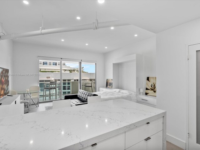 1200 W Ave Unit Ph24, Miami Beach, FL 33139 - kitchen featuring recessed lighting, white cabinets, and light stone countertops