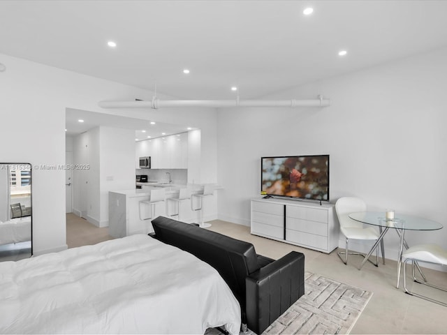 1200 W Ave Unit Ph24, Miami Beach, FL 33139 - bedroom with recessed lighting, a sink, and baseboards