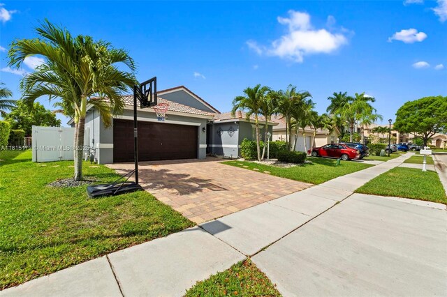 14420 NW 16th St, Pembroke Pines, FL 33028 - view of front of property featuring decorative driveway, stucco siding, an attached garage, and a tile roof