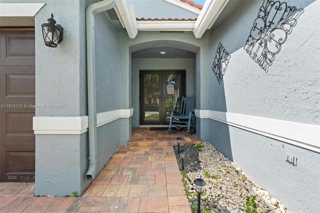 14420 NW 16th St, Pembroke Pines, FL 33028 - doorway to property featuring french doors, stucco siding, and a tiled roof