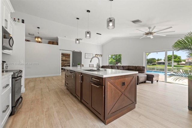 14420 NW 16th St, Pembroke Pines, FL 33028 - kitchen featuring appliances with stainless steel finishes, a ceiling fan, light countertops, white cabinetry, and lofted ceiling