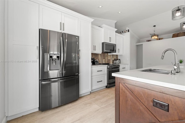14420 NW 16th St, Pembroke Pines, FL 33028 - kitchen with appliances with stainless steel finishes, ornamental molding, white cabinetry, light wood-style floors, and light countertops