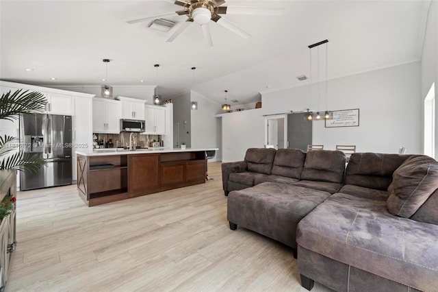 14420 NW 16th St, Pembroke Pines, FL 33028 - living room with crown molding, a ceiling fan, light wood-style floors, recessed lighting, and vaulted ceiling