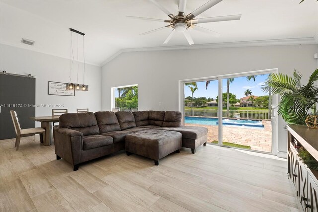 14420 NW 16th St, Pembroke Pines, FL 33028 - living room featuring lofted ceiling, crown molding, a ceiling fan, and light wood-style floors