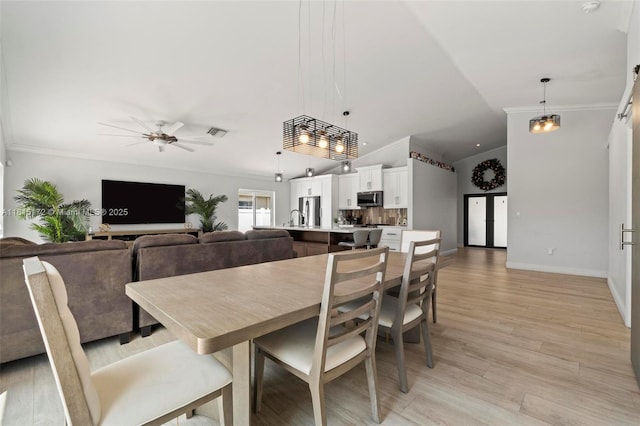 14420 NW 16th St, Pembroke Pines, FL 33028 - dining space featuring crown molding, a ceiling fan, lofted ceiling, and light wood finished floors