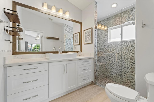 14420 NW 16th St, Pembroke Pines, FL 33028 - bathroom featuring a shower stall, vanity, healthy amount of natural light, and wood finished floors