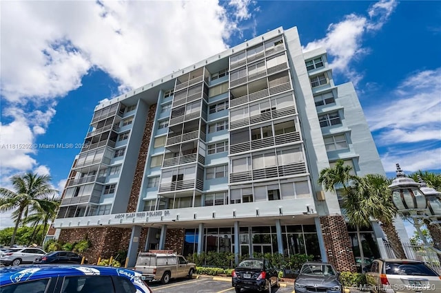 16850 S Glades Dr Unit 8G, North Miami Beach, FL 33162 - view of apartment building / complex with uncovered parking