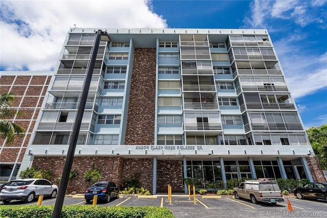 16850 S Glades Dr Unit 8G, North Miami Beach, FL 33162 - view of apartment building / complex featuring uncovered parking