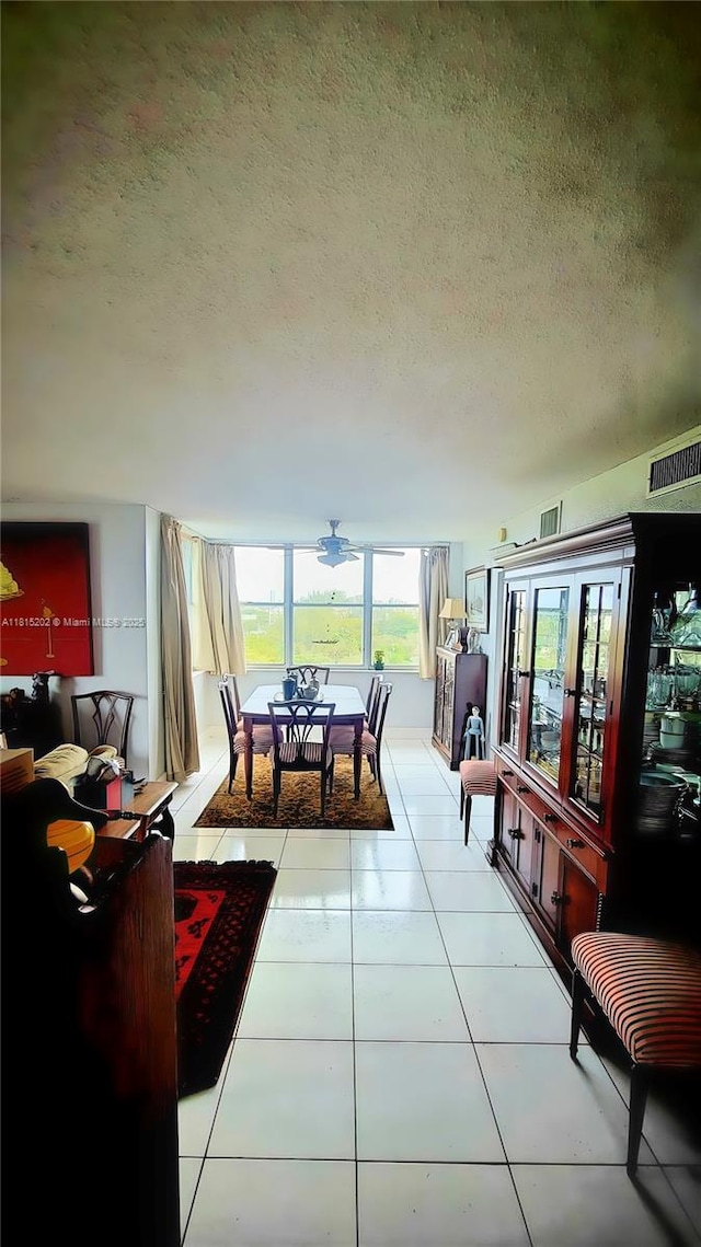 16850 S Glades Dr Unit 8G, North Miami Beach, FL 33162 - tiled dining room with a textured ceiling