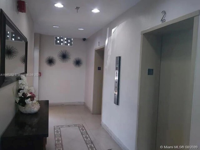 16850 S Glades Dr Unit 8G, North Miami Beach, FL 33162 - corridor featuring recessed lighting, baseboards, elevator, and inlaid floor details