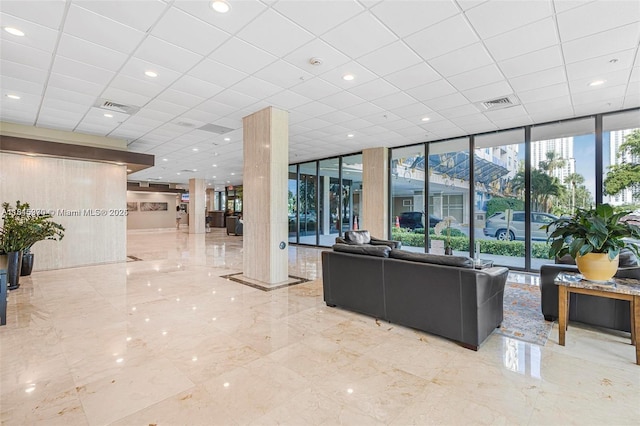 400 Kings Point Dr Unit 831, Sunny Isles Beach, FL 33160 - community lobby featuring a wall of windows and a paneled ceiling
