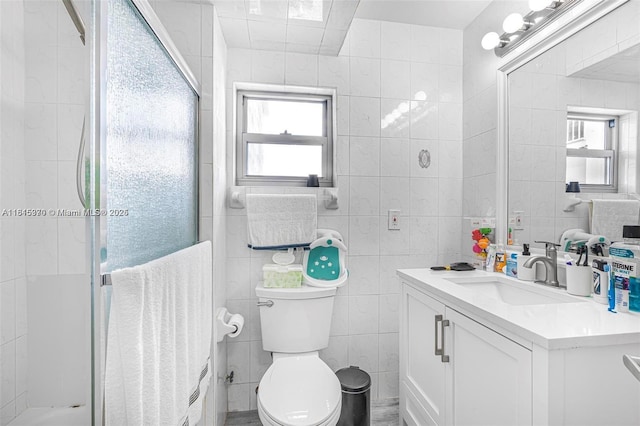 400 Kings Point Dr Unit 831, Sunny Isles Beach, FL 33160 - full bath featuring tile walls, vanity, a stall shower, toilet, and plenty of natural light