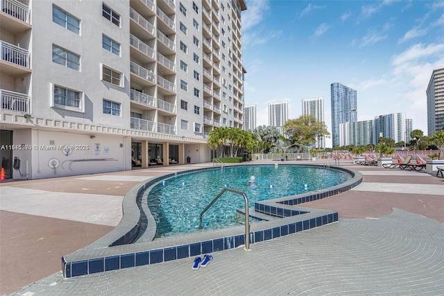 400 Kings Point Dr Unit 831, Sunny Isles Beach, FL 33160 - community pool featuring a view of city and a patio area