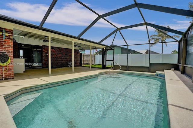 2398 SE Bordeaux Ct, Port St Lucie, FL 34952 - outdoor pool featuring a patio area, ceiling fan, and glass enclosure