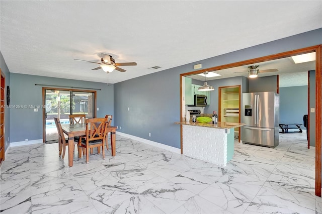 2398 SE Bordeaux Ct, Port St Lucie, FL 34952 - dining room with a ceiling fan, baseboards, and light marble finish floors