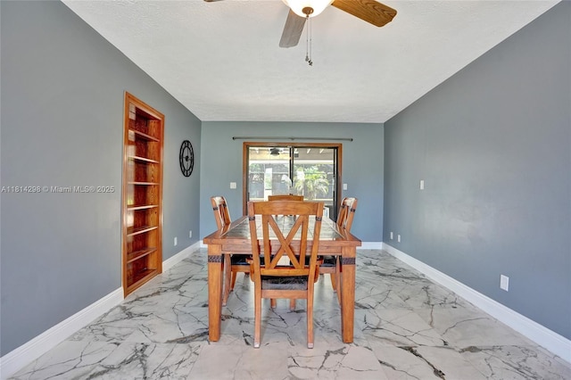 2398 SE Bordeaux Ct, Port St Lucie, FL 34952 - dining space featuring light marble finish floors, built in shelves, a ceiling fan, baseboards, and a textured ceiling