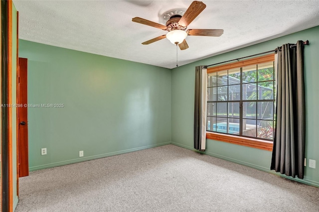 2398 SE Bordeaux Ct, Port St Lucie, FL 34952 - carpeted empty room featuring a textured ceiling, ceiling fan, and baseboards
