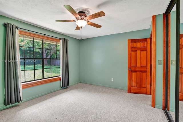 2398 SE Bordeaux Ct, Port St Lucie, FL 34952 - unfurnished room with carpet floors, ceiling fan, baseboards, and a textured ceiling