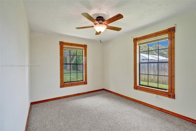 2398 SE Bordeaux Ct, Port St Lucie, FL 34952 - carpeted empty room with baseboards, ceiling fan, and a textured ceiling