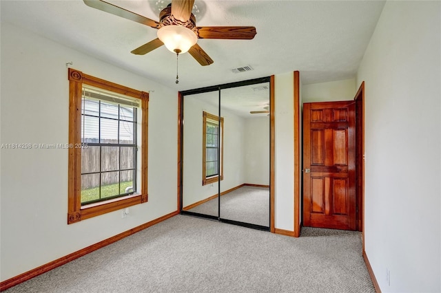 2398 SE Bordeaux Ct, Port St Lucie, FL 34952 - unfurnished bedroom with carpet, baseboards, a closet, and a ceiling fan