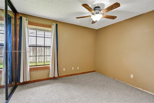 2398 SE Bordeaux Ct, Port St Lucie, FL 34952 - empty room with carpet floors, ceiling fan, and baseboards