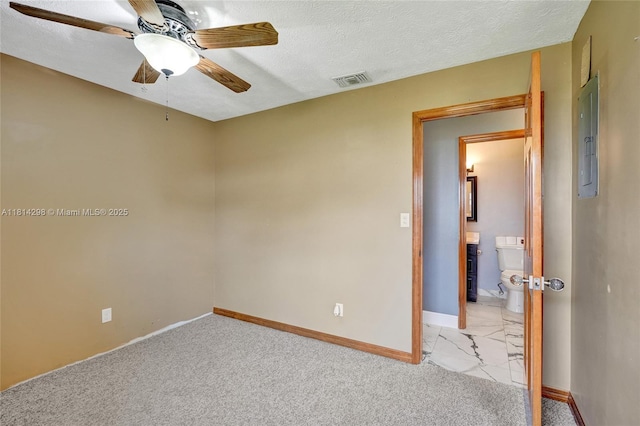 2398 SE Bordeaux Ct, Port St Lucie, FL 34952 - empty room with a ceiling fan, baseboards, light colored carpet, and a textured ceiling