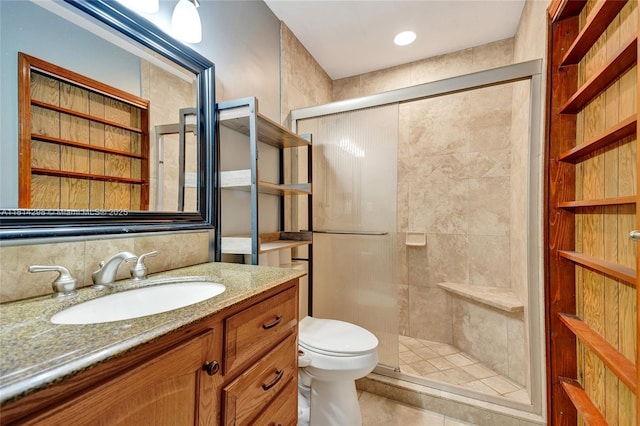 2398 SE Bordeaux Ct, Port St Lucie, FL 34952 - bathroom featuring a shower stall, vanity, toilet, and tile patterned flooring