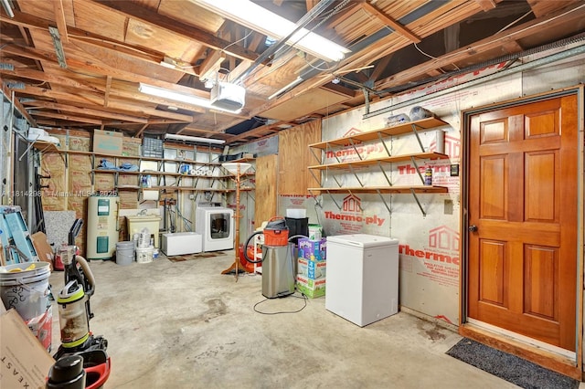 2398 SE Bordeaux Ct, Port St Lucie, FL 34952 - unfinished below grade area featuring washing machine and dryer, refrigerator, and electric water heater