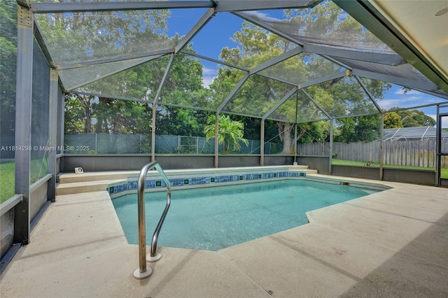 2398 SE Bordeaux Ct, Port St Lucie, FL 34952 - view of swimming pool with a fenced backyard, a patio area, and a lanai