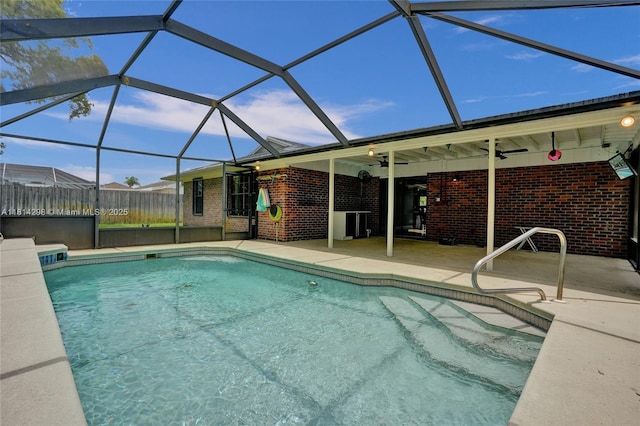 2398 SE Bordeaux Ct, Port St Lucie, FL 34952 - swimming pool featuring ceiling fan, a patio area, and glass enclosure
