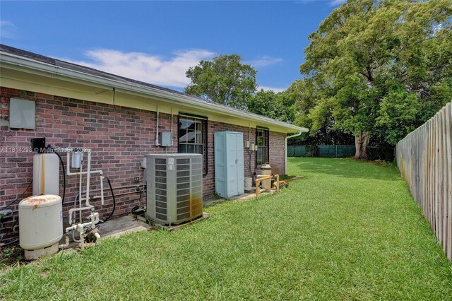 2398 SE Bordeaux Ct, Port St Lucie, FL 34952 - view of yard featuring central AC unit
