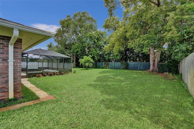 2398 SE Bordeaux Ct, Port St Lucie, FL 34952 - view of yard with a lanai